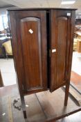 An early 20th Century mahogany side cabinet having shelved interior, approx. dimensions height 92