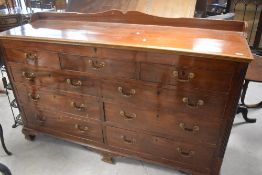 A Georgian mahogany 'mule chest' having ledge back, lift lid revealing shallow storage under, with