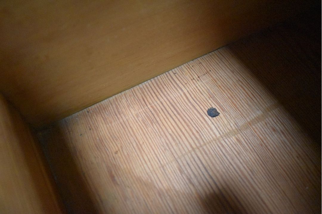 A Victorian dark stained pine chest of three long drawers, having shaped ledge back and turned - Image 3 of 4