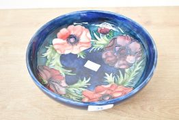 A 20th-century Moorcroft pottery 'Anenome' pattern centre bowl, featuring delicate tube-lined floral