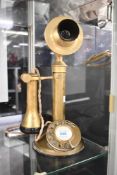 An early 20th-century General Electrical Company (GEC) brass candlestick telephone, featuring a tall
