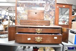 Two large early to mid 20th-century mahogany cased cutlery services, to include a selection of