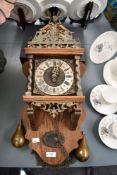 A fine mid 20th-century Dutch Warmink (Wuba) Zaandam Zaanse-style wall clock, featuring an ornate
