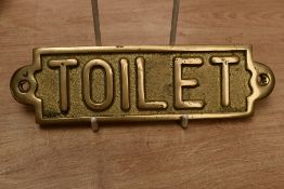 A 20th-century brass 'TOILET' plaque, 18.5cm, sold as seen.