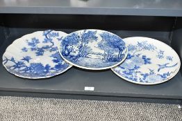 Three large late 29th to early 20th-century blue and white decorative chargers, to feature a Boch