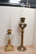 A tall late 19th to early 20th-century brass oil lamp, having a Corinthian column base with