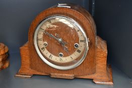 An early 20th-century Art Deco-style wooden mantel clock, marked, 31cm in length and 22cm in height,