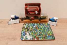 A selection of 20th-century glass marbles, to feature mainly colourful onion twist examples and 10