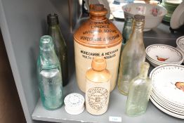 A selection of late 19th to early 20th-century glass and stoneware, to feature a large J. Walsh,