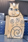 A large contemporary Laurel Burch-style carved wooden cat, featuring hand painted floral