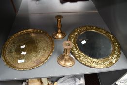 A vintage Peerage brass wall mirror, of circular form with hammered grape and vine detailing; sold