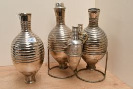 An early 20th-century Italian Calegaro Art Deco silver-plated decanter and wine flask set, of “