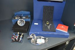 A selection of 20th-century decorative crystalware, to feature a small Swarovski display tulip
