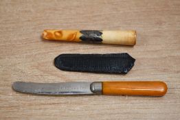 A late Victorian silver mounted cheroot holder having an amber mouth piece, marks for Chester