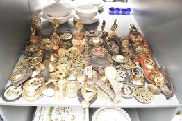 A large quantity of late 19th to 20th-century brass martingales and related ephemera, to feature a