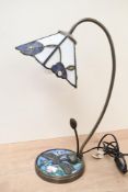 A 20th-century Tiffany-style table lamp, featuring a delicate blue floral flower-shaped shade,