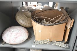 Two early to mid 20th-century glass lamp shades to feature a striped grid example and a pink milk
