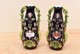 Two early 20th-century Art Nouveau Josef Strnact majolica bud vases, featuring a deep cobalt blue