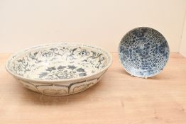 A large presumed 15th/16th-century Annamese-style blue and white ceramic charger; featuring hand