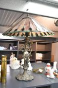 A large contemporary Tiffany-style fan table lamp, featuring a colourful shade of repeating