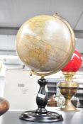 A 20th-century Greaves and Thomas 12' 'Present Day Globe' scale 1:41, upon a turned stained wooden
