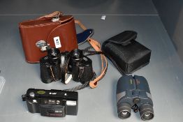 Two pairs of Binoculars and a camera. A Minolta AF-E camera, A pair of Sunagor 12~40x27 MC Zoom