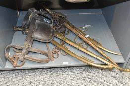 A quantity of large late 19th to early 20th-century leather and brass work horse tack, unmarked,