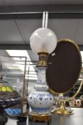 A fine late 19th century French Hadrot brass oil lamp, featuring a frosted glass globe shade with