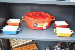 A small quantity of vintage colourful cookware, to feature a red French Fonte émaillée cast iron