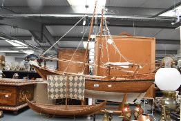 A large mid to late 20th-century hand constructed wooden Arab Dow, featuring fabric and rope