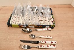 A contemporary Emma Bridgewater red star pattern stainless steel cutlery set, to feature knives,
