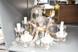 A large 20th-century French brass and glass 8-light pendant chandelier, having characteristics of