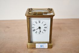 A small 20th-century brass 5 glass carriage clock, of Roman hours, unmarked, 10.5cm in height,