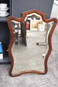 A 20th-century French-style mahogany vanity dressing table mirror, of scrolled form, unmarked with