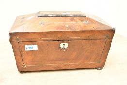 A 19th-century mahogany tea caddy, of sarcophagus-form with a raised lid, having delicate floral-