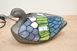 A contemporary Tiffany-style Duck table lamp, featuring a textural metal head and base with a