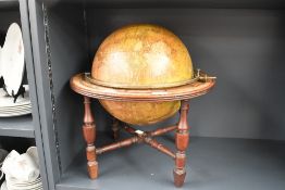 A fine George III/Regency British terrestrial table top library globe with brass meridian,