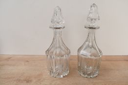 Two Victorian cut glass decanters, of bludgeon-form, featuring spire stopper and etched cornucopia