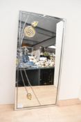 A contemporary Looking Glass Art lead mirror, featuring Art Nouveau-style floral detailing, marked