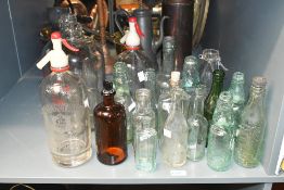 A selection of late 19th to 20th-century glass bottles, to feature a Boots The Chemist medicinal
