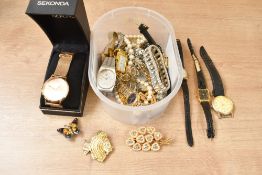 An assortment of costume jewellery, including a boxed Sekonda wristwatch, brooches and paste set