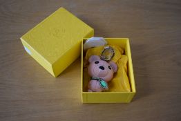 A Svarovski teddy bear bag charm keyring, in smooth pbaby pink leather with emerald green and pink