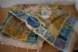 An antique handmade Suzani wedding quilt, showcasing intricate techniques such as embroidery,