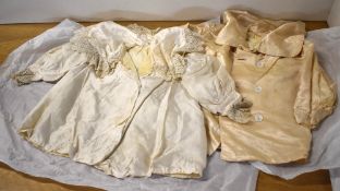 Assorted antique Victorian/Edwardian baby clothes, to include a silk double breasted coat, silk