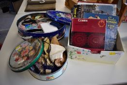 Two vintage floral tins containing a quantity of miscellaneous haberdashery to include buttons,