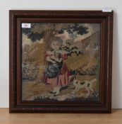 A framed and glazed needlework cross stitch embroidery depicting a girl in a garden with a dog, with