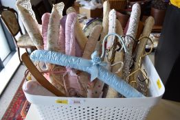 Assorted vintage coat hangers to include mostly satin covered along with some innovative metal