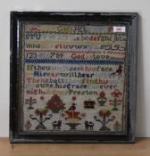 A framed and glazed needlework sampler performed by Agnes Preston, depicts the alphabe, numbers