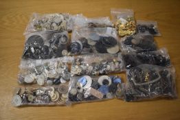 A quantity of assorted vintage button and buckles to include glass, shell, wood, gilt, and other