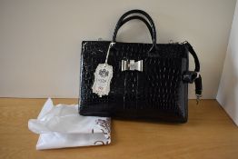A LYDC London handbag in black patent croc, effect with white metal bow shaped buckle and